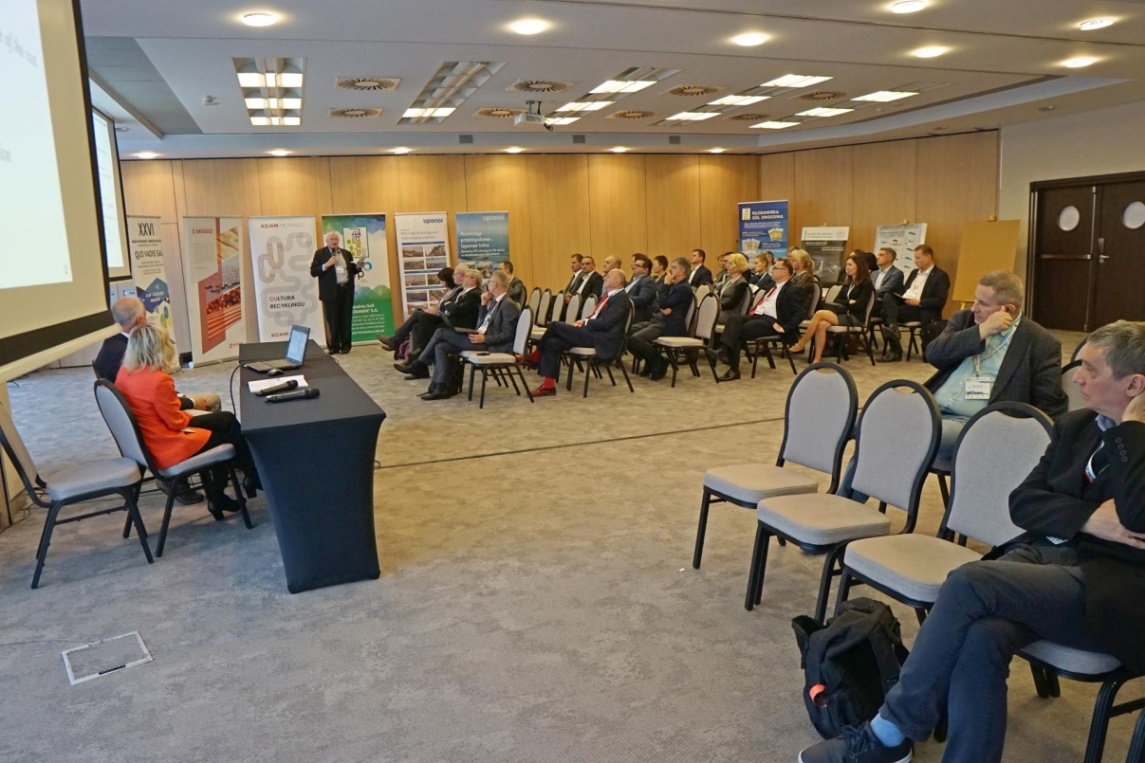 person giving lecture in front of the audience